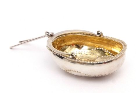 Early 19th century Russian silver parcel gilt tea strainer, modelled in the form of a basket with applied gadrooned border, g