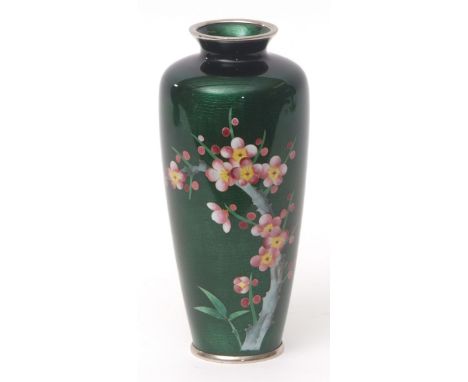 Japanese cloisonne and gin bari enamel vase decorated with a spray of prunus blossom against a vibrant emerald green transluc