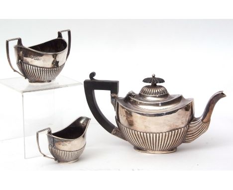 Edward VII bachelor's three piece tea set of half fluted oval form and comprising tea pot, sugar basin and milk jug, length o