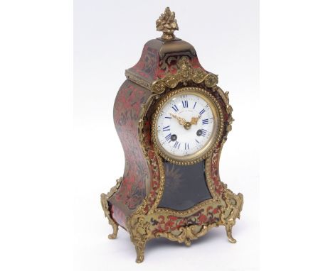 Late 19th century French boule type mantel clock, the waisted case surmounted by a floral urn finial and with mask foliate an