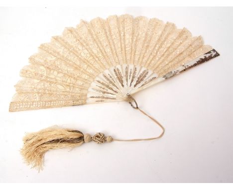 Late 19th/early 20th century mother of pearl, silver and lace fan of 16 stick construction with applied silver floral and fol