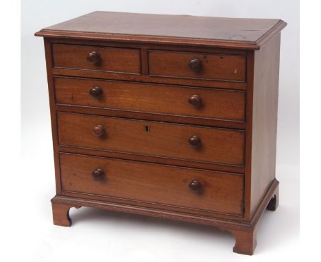 Mahogany apprentices chest with moulded edge over two short and three full width graduated drawers on bracket feet, 19th cent