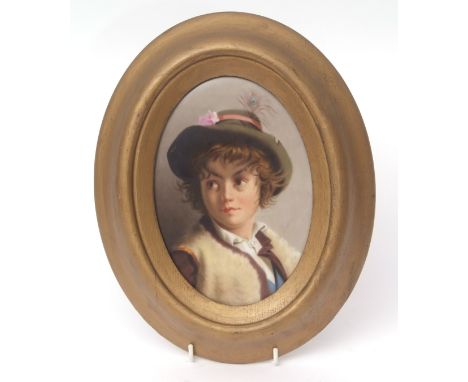 Continental KPM style porcelain plaque painted with a head and shoulders portrait of a young boy, 29cms long  