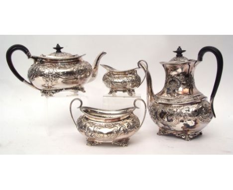 Late Victorian four piece tea and coffee service comprising tea pot, coffee pot, sugar basin and milk jug, each of oval form 