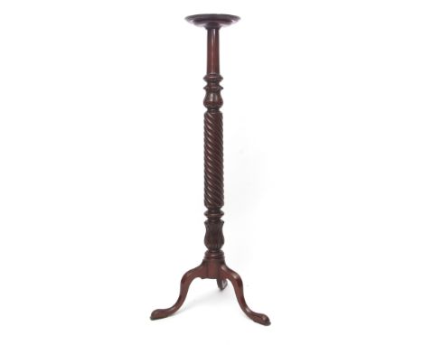 19th century mahogany torchere stand circular top on a wrythen stem terminating in a tripod base with hoof feet, 136cms high 