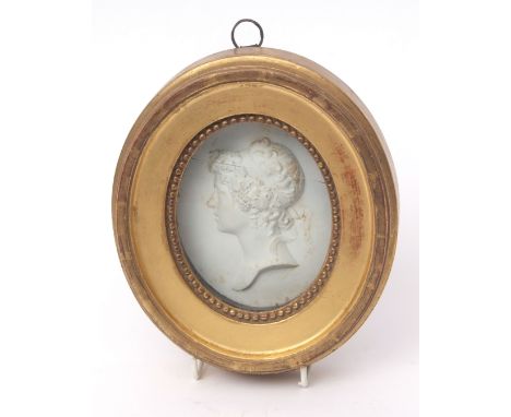 Continental biscuit porcelain oval medallion modelled as a head adnd shoulders portrait of a classical maiden in a gilt frame