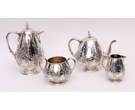 Victorian four piece tea set comprising hot water pot, tea pot, sugar basin and milk jug, each of ovoid form, the former with