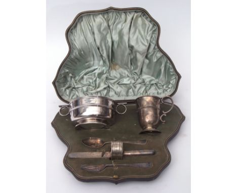 Victorian comprehensive christening set comprising a two-handled bowl of polished circular form with applied ring handles and