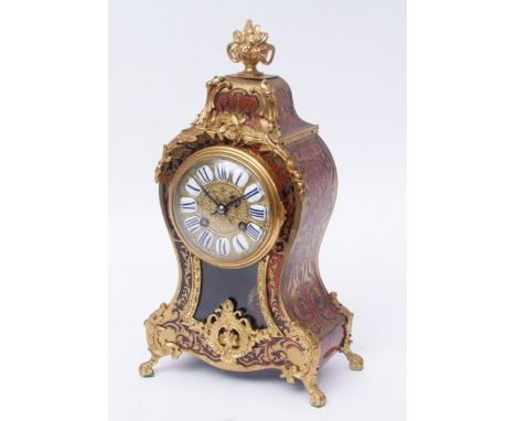 Late 19th century French boule type mantel clock, the waisted case surmounted by a flowering urn finial decorated on three si