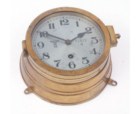 Mid-20th century German lacquered brass Kriegsmarine issued bulkhead timepiece, the drum shaped case with set three fixing ta
