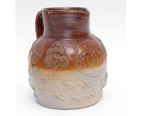 Late 18th century Mortlake (Kishere) jug decorated in tones of grey and brown with orange peel effect, with hunting scenes in