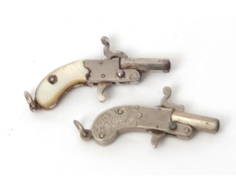 Mixed Lot: two various small novelty cap pistols, the first of all base metal construction with sprung hammer and trigger, th