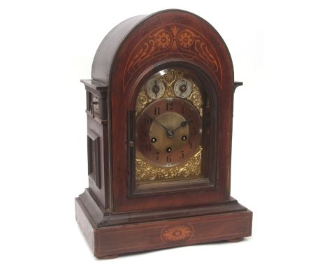 Early 20th century German walnut and inlaid triple spring barrel mantel clock, Junghans, the arched case with side stepped pe