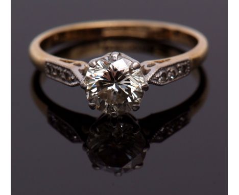 Precious metal single stone diamond ring, the brilliant cut diamond 0.60ct approx, raised between small diamond highlighted s