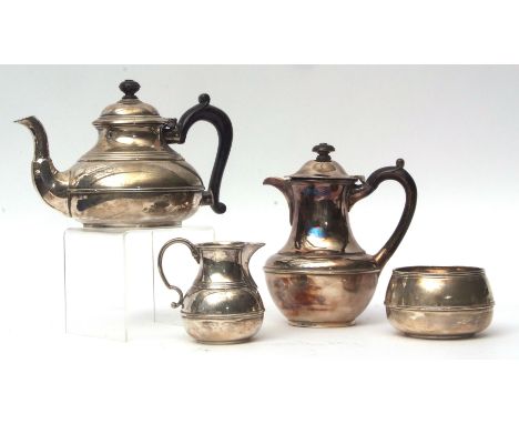 George V four piece tea set comprising hot water pot, tea pot, sugar basin and milk jug, each of compressed circular form, wi