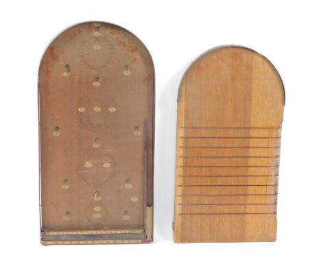 A vintage bagatelle, with balls, together with a shove halfpenny board. (2)
