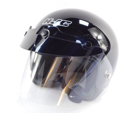 An HJC black motorcycle helmet Fl-22, with flip up visor, 65/8 / 6¾ inches.