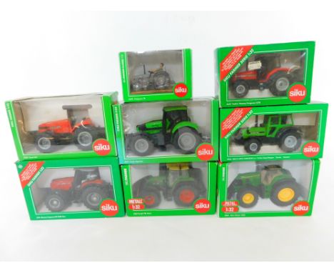 Eight Siku Farmer Series die cast models of tractors, scale 1:32, boxed.