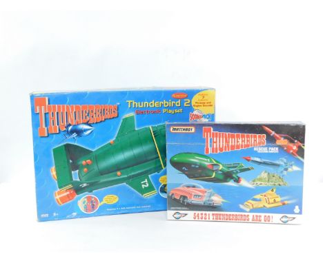 A Carlton Thunderbirds Thunderbird 2 Electronic Play Set, with seven authentic phrases and engine sounds, together with a Mat