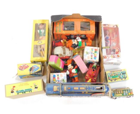 Games and toys, to include a Pelham Puppet Dutch Girl, tin plate playing ping pong, Golden Falcon battery operated locomotive