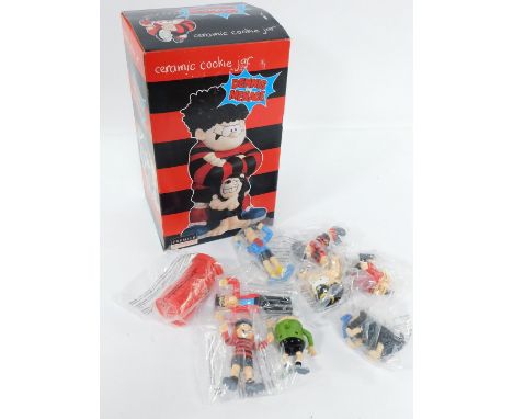 A Dennis The Menace ceramic cookie jar, boxed, together with various Dennis The Menace figures. (a quantity)