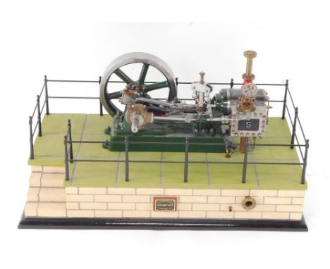 A Stuart Turner No 9 steam engine, scratch built, on a naturalistic fenced and bricked rectangular base, model 28cm wide.
