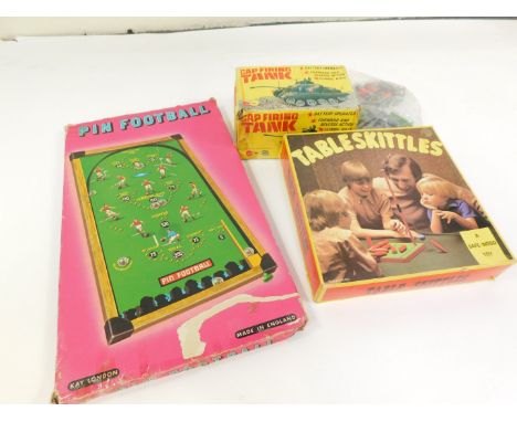 A Pin Football Bagatelle, table skittles, cap firing tank and various soldiers. (a quantity)