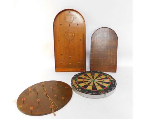 A Winmau dartboard, hoopla board, shove halfpenny board, and a Chad Valley Hit - A - Pin bagatelle. (4)