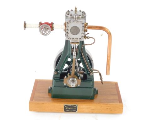 A Stuart Turner No 7A vertical steam engine, scratch built, on a rectangular wooden base, 19cm high.
