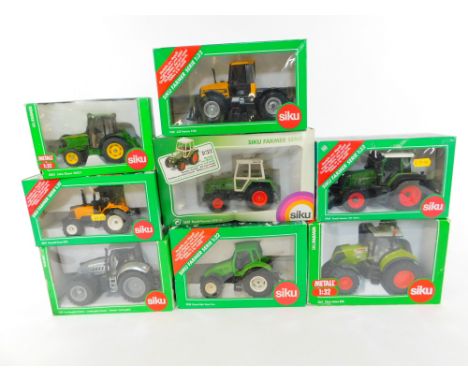 Eight Siku Farmer Series die cast models of tractors, scale 1:32, boxed.