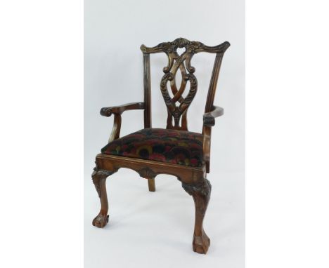 A Chippendale style mahogany doll's carver chair, with foliate carved back rail and splat, acanthus leaf, scroll arms, drop-i