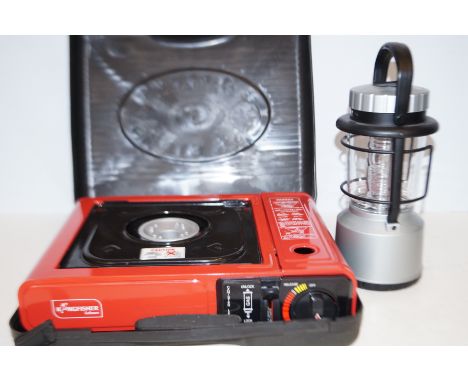 Camping stove together with light