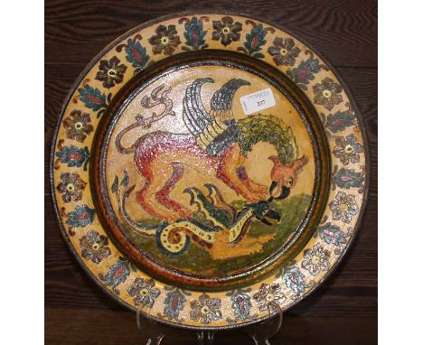 ITALIAN POLYCHROME CERAMIC PLATE
with floral pattern border, with two fighting griffins to the centre, signed to the reverse,