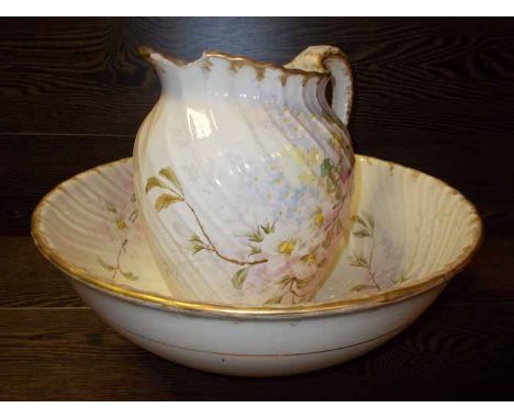 LARGE HAND PAINTED FLUTED JUG AND WASH BASIN
with fluted bodies, bright pastel floral decoration, jug 26cm high
Losses and cr