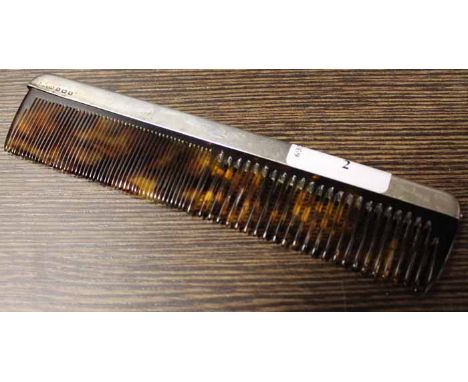 SILVER MOUNTED TORTOISESHELL COMB
maker Synyer & Beddoes, Birmingham 1924, engraved with scrolling design, 18cm long
Note: Go