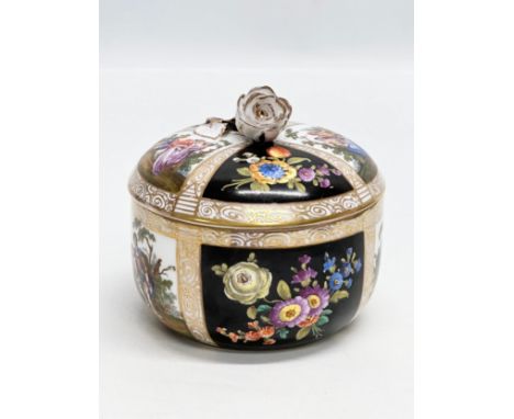 Augustus Rex. A Late 19th Century hand painted porcelain trinket box with cover and rose handle. 10.5x10.5cm.