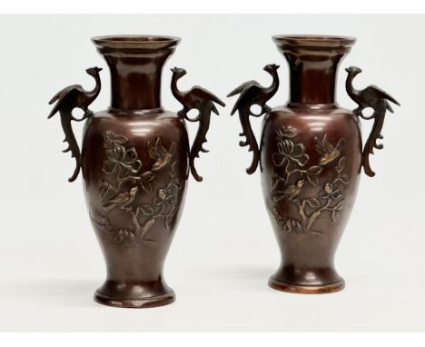 A pair of Late 19th Century Japanese bronze baluster vases, with embossed birds in flight, trees and 2 crane handles. Meiji P