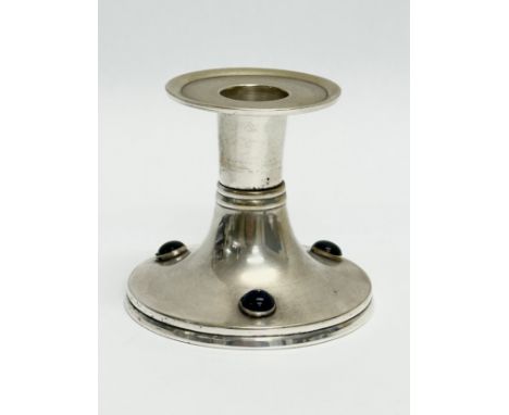 An Early 20th Century Arts &amp; Crafts silver plated candlestick. 8.5x7.5cm