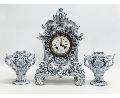 Parkinson &amp; Frodsham. A large Late 19th Century 3 piece flower encrusted porcelain clock set with 2 reticulated vases. Wi