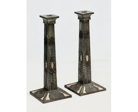 A pair of tall Early 20th Century Art Nouveau pewter and mother of pearl candlesticks. Circa 1900. 12x12x31cm.