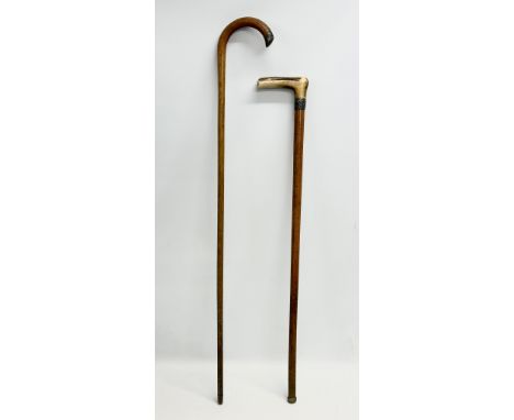 2 vintage silver mounted walking sticks.