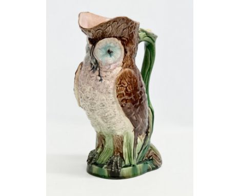 A Late 19th Century Majolica owl pitcher. 26x29cm