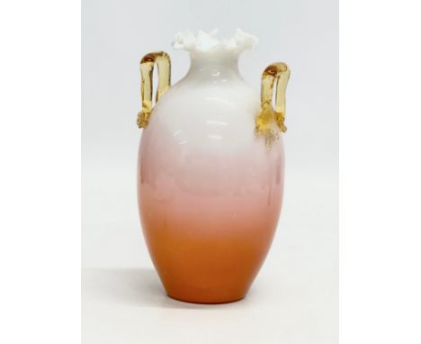 A Late 19th Century Bohemian, uranium and opaline glass vase, with amber glass handle and flared rim. In the manner of Loetz.