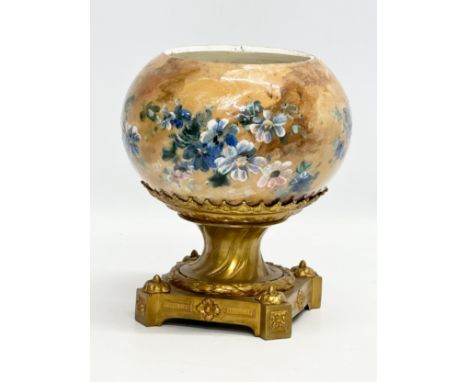 A Late 19th Century French hand painted pottery bowl on a gilt bronze base. 18x18x22cm.