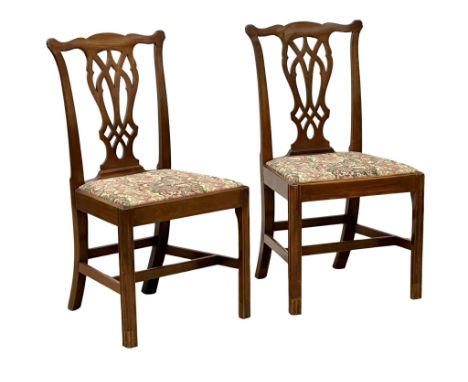 A pair of Late 18th Century George III mahogany chairs in the Chippendale style. Circa 1780.