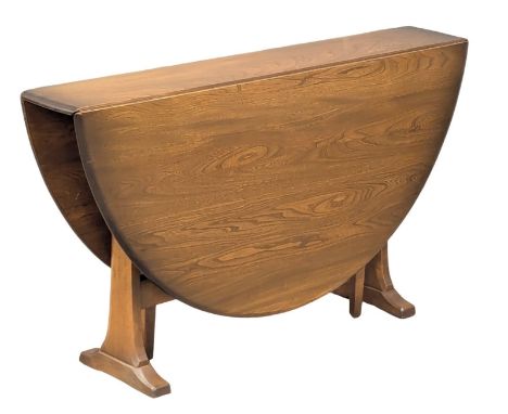 An Ercol Mid Century "Golden Dawn" elm drop-leaf dining table. Extended 140x128x71cm. 1