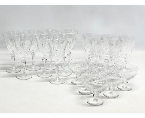 Three sets of vintage crystal drinking glasses. Wine glasses and cocktail/dessert glasses.