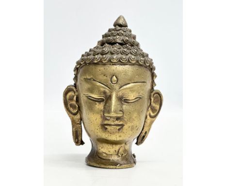 An 18th/Early 19th Century Sino-Tibetan bronze Buddha head. 16cm