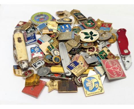A quantity of vintage Soviet badges with pen knives