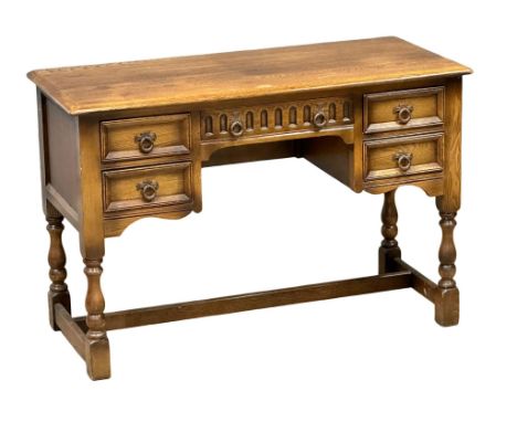 A vintage oak desk/side table. 107x45x71cm. (8)